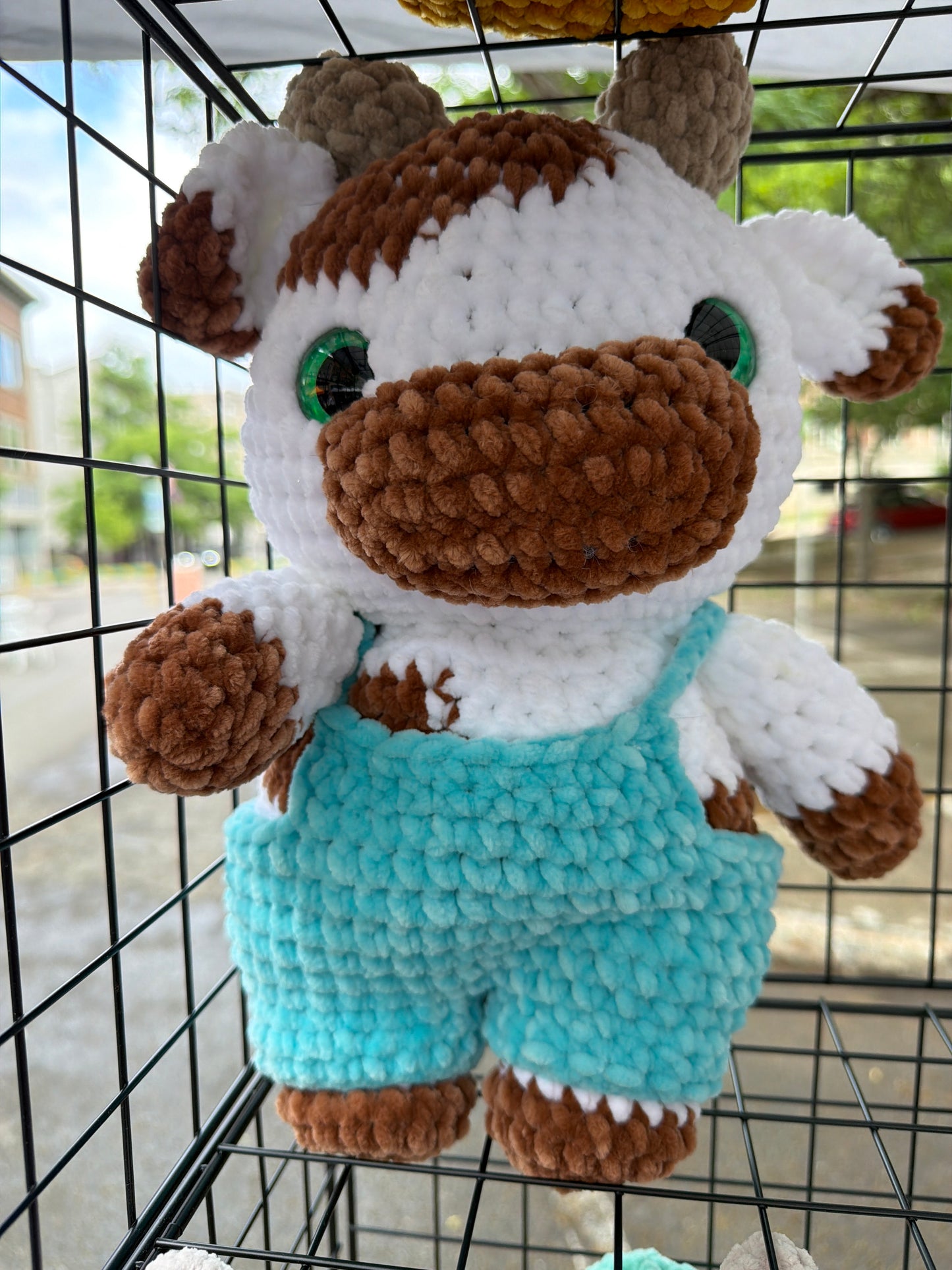 Cow in tiny overalls