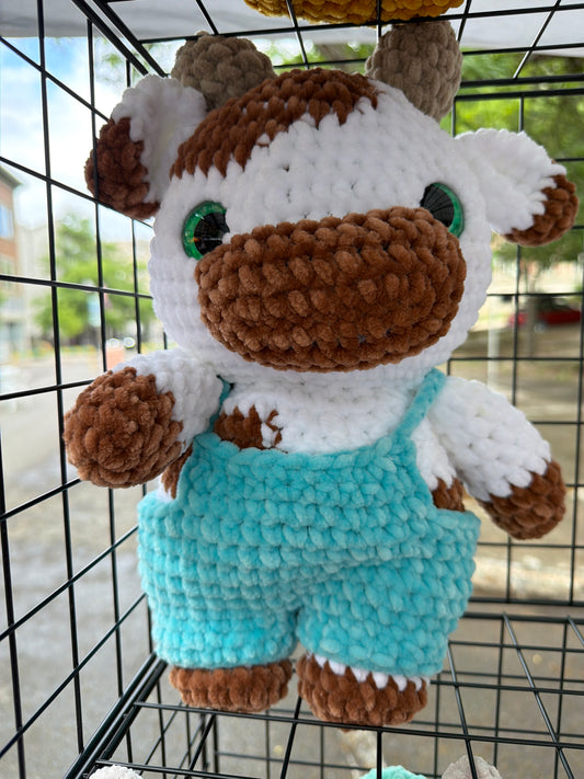 Cow in tiny overalls
